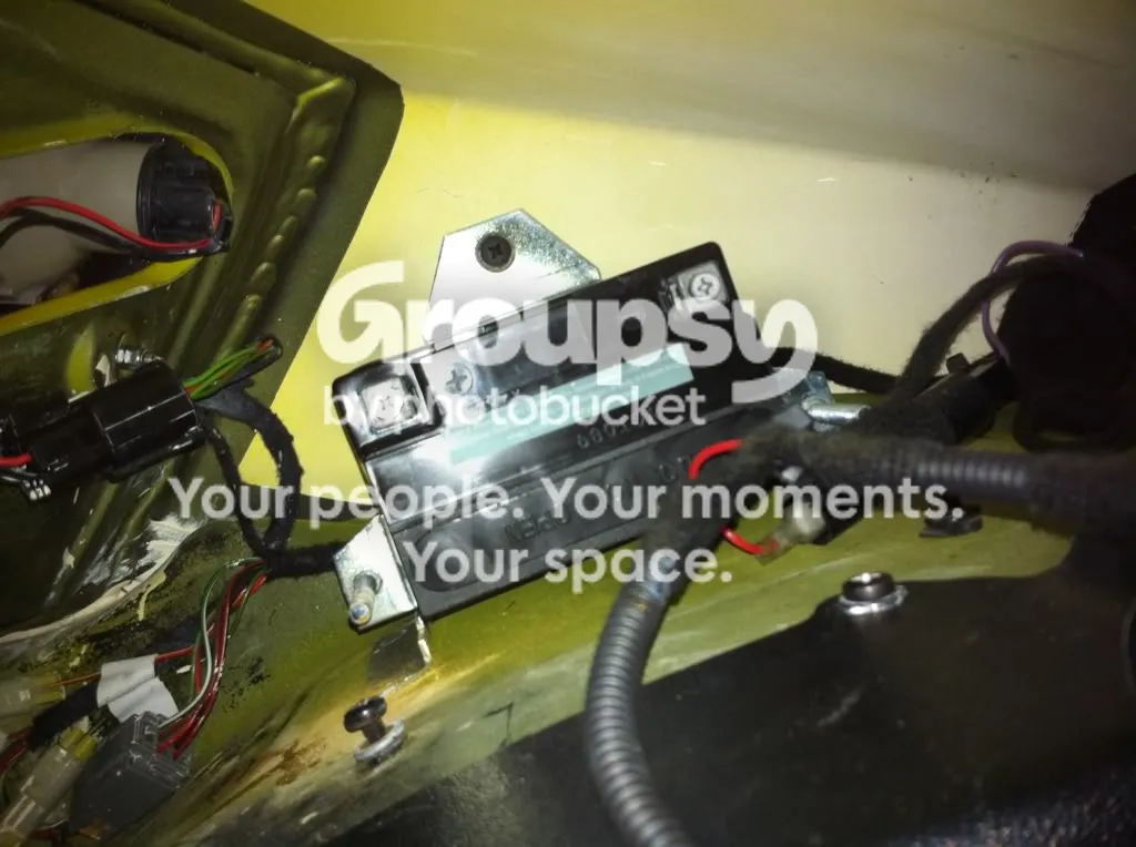 A second view of the backup battery in its bracket with the leads attached