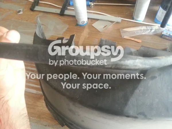 A close-up of the old hose held in a hand