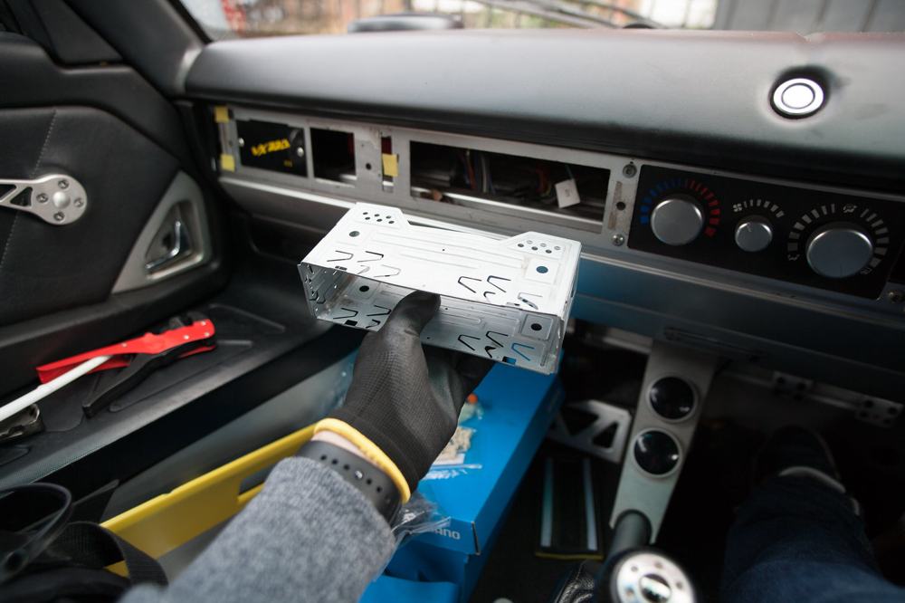 The empty radio cage in the dash