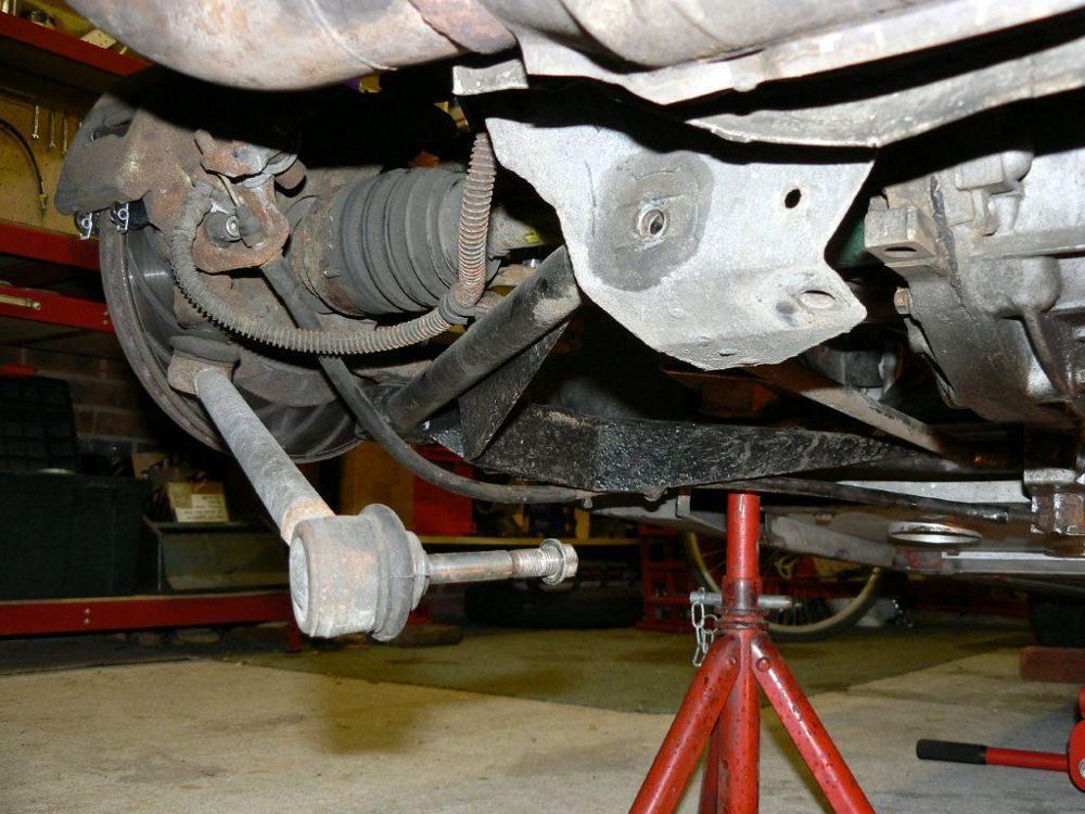 The lower wishbone mounting and the driveshaft with its boot