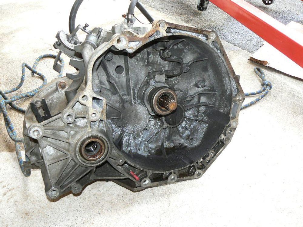 The F23 gearbox on the garage floor, bellhousing facing the camera