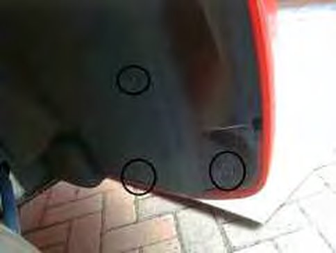 The inner arch pulled down, with circled screws