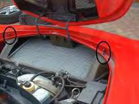 Two circled screws under the bonnet, with the nose below