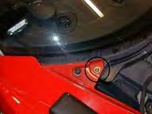 The screw at the side of the car, circled