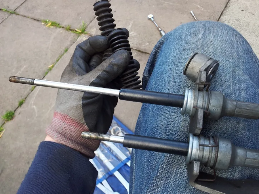 Rubber boots being removed from the old cable ends