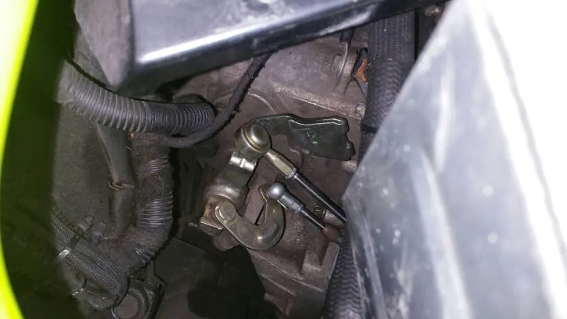 The cable ends on the gearbox selector seen from above