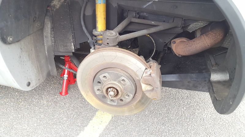 Rear wheel removed showing the brake and handbrake cable