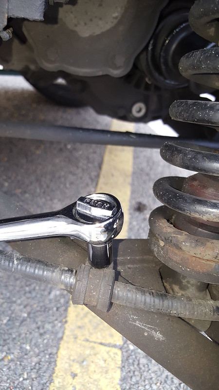 The handbrake cable P clamp on the wishbone