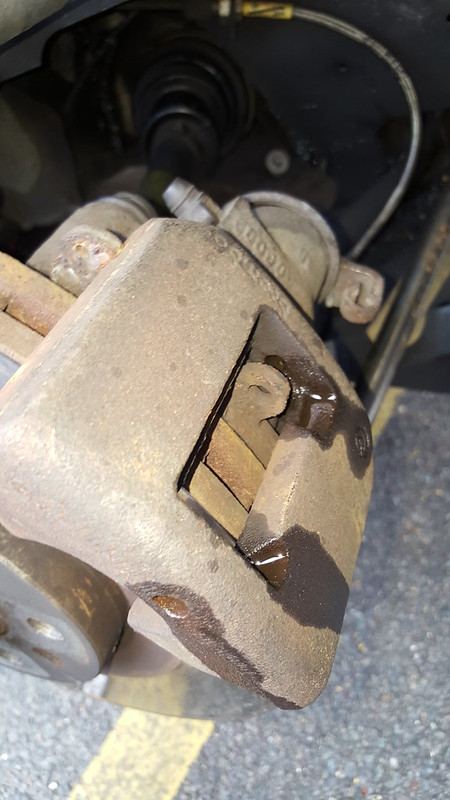 The pad pin and clip in the caliper