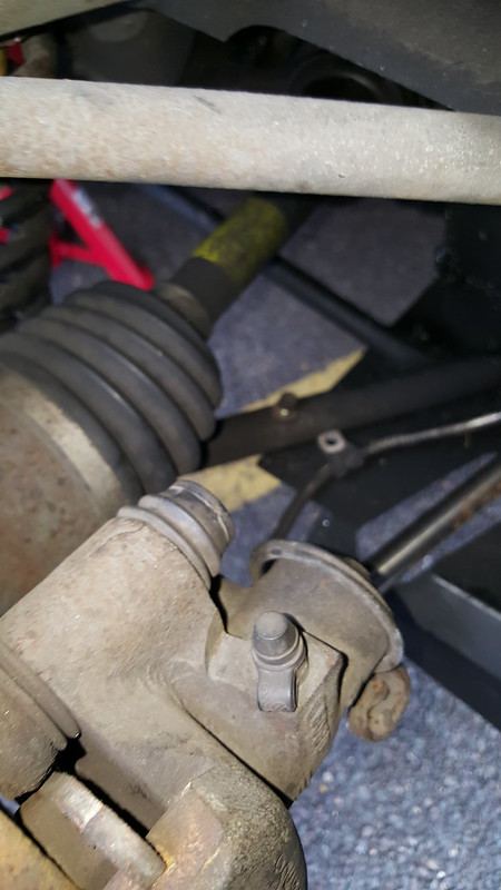 The caliper being pivoted away from the disc