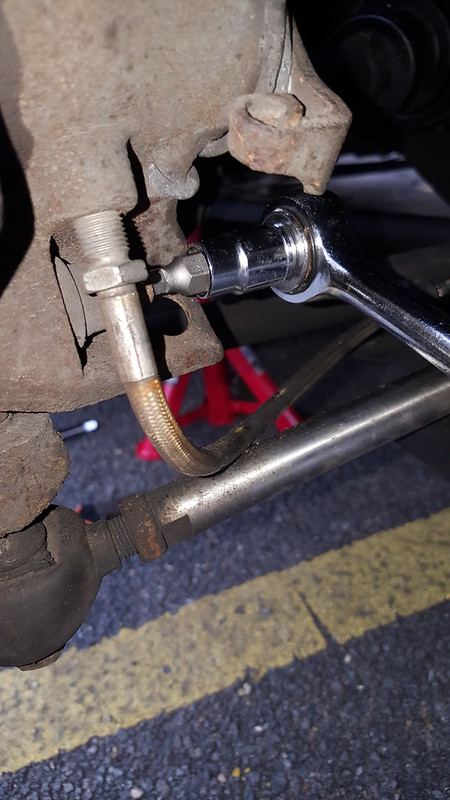 The lower caliper bolt