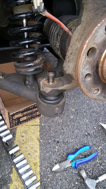 The lower ball joint with the nut removed