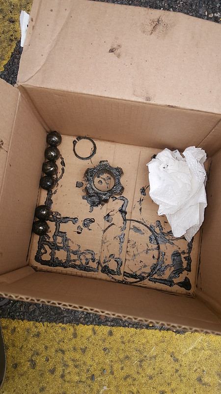 The CV joint parts laid out in a box