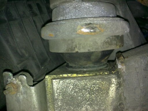 A split engine mount, seen from the wheel arch