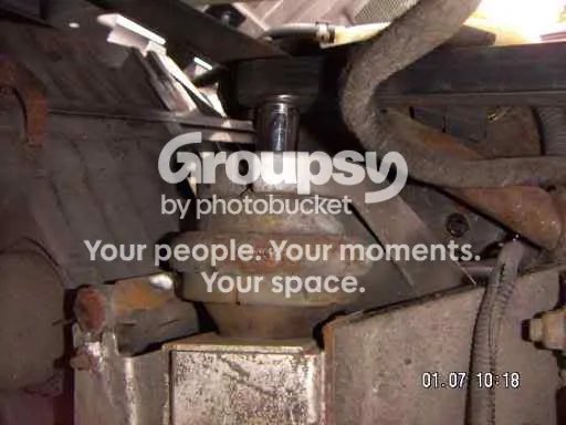 Socket on the top mount bolt, from above the mount