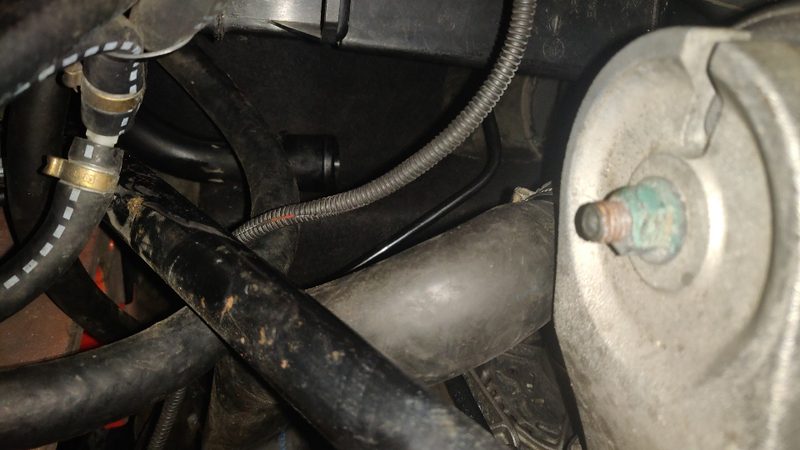 Wheel arch area with the evap hoses and clips and the engine mount