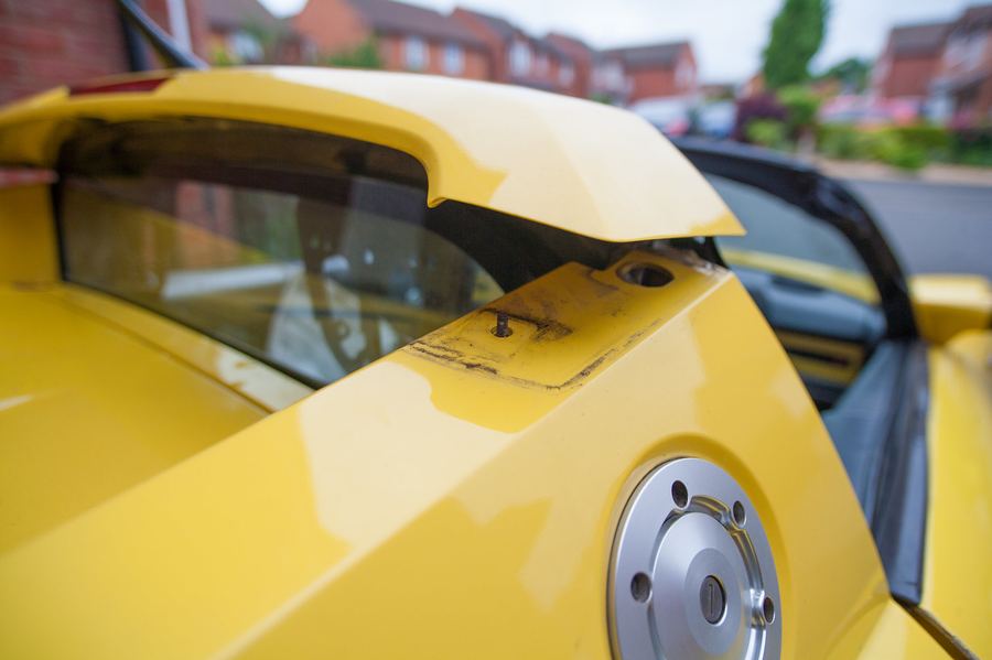 Tilting the roll bar cover forward