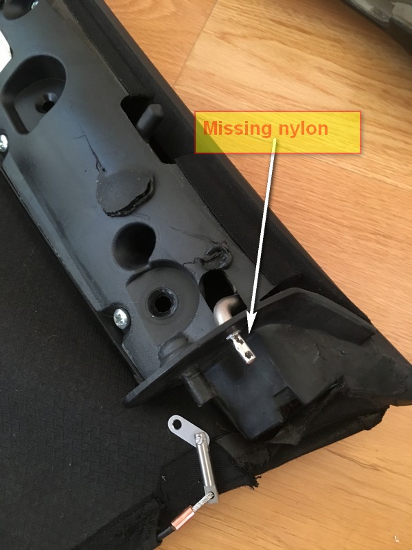 The other hood support with a labelled missing nylon cover, leaving a bare metal pin
