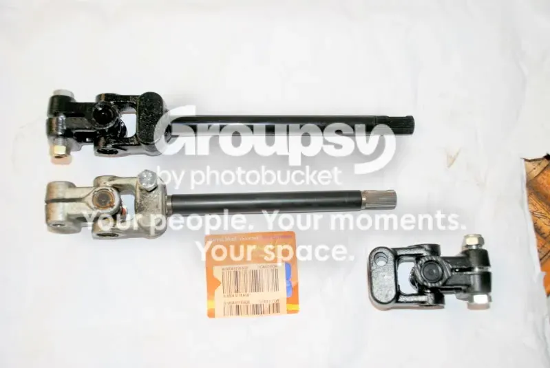 Three steering column joint assemblies on a sheet: two with a long shaft and one single joint
