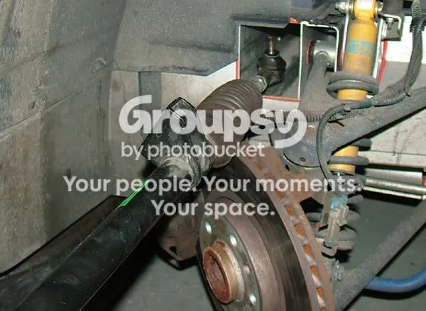 The rack lying in the arch with the track-rod end pointing upwards beside the damper