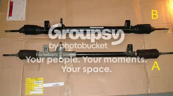 Two steering racks on cardboard, B at the top with a plain casing and A below with a cast housing at the spigot