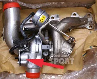 A boxed Astra VXR turbo with a red arrow marked on the compressor outlet and a Courtenay Sport watermark