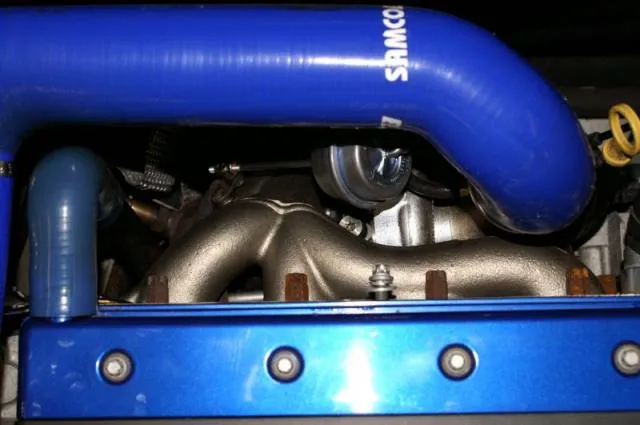 The fitted VXR turbo with a red cap on the outlet, seen from above in the engine bay